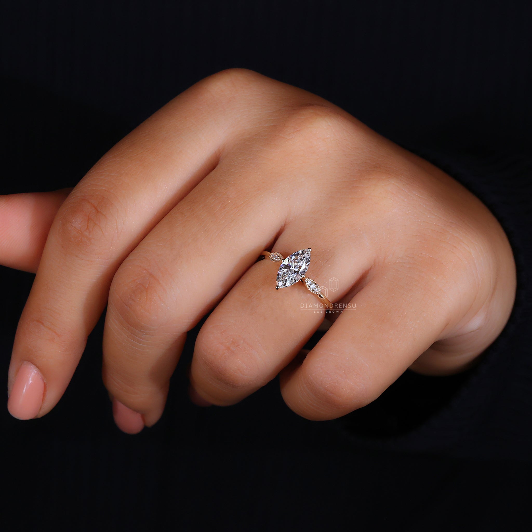 Compass prong setting with marquise diamond.
