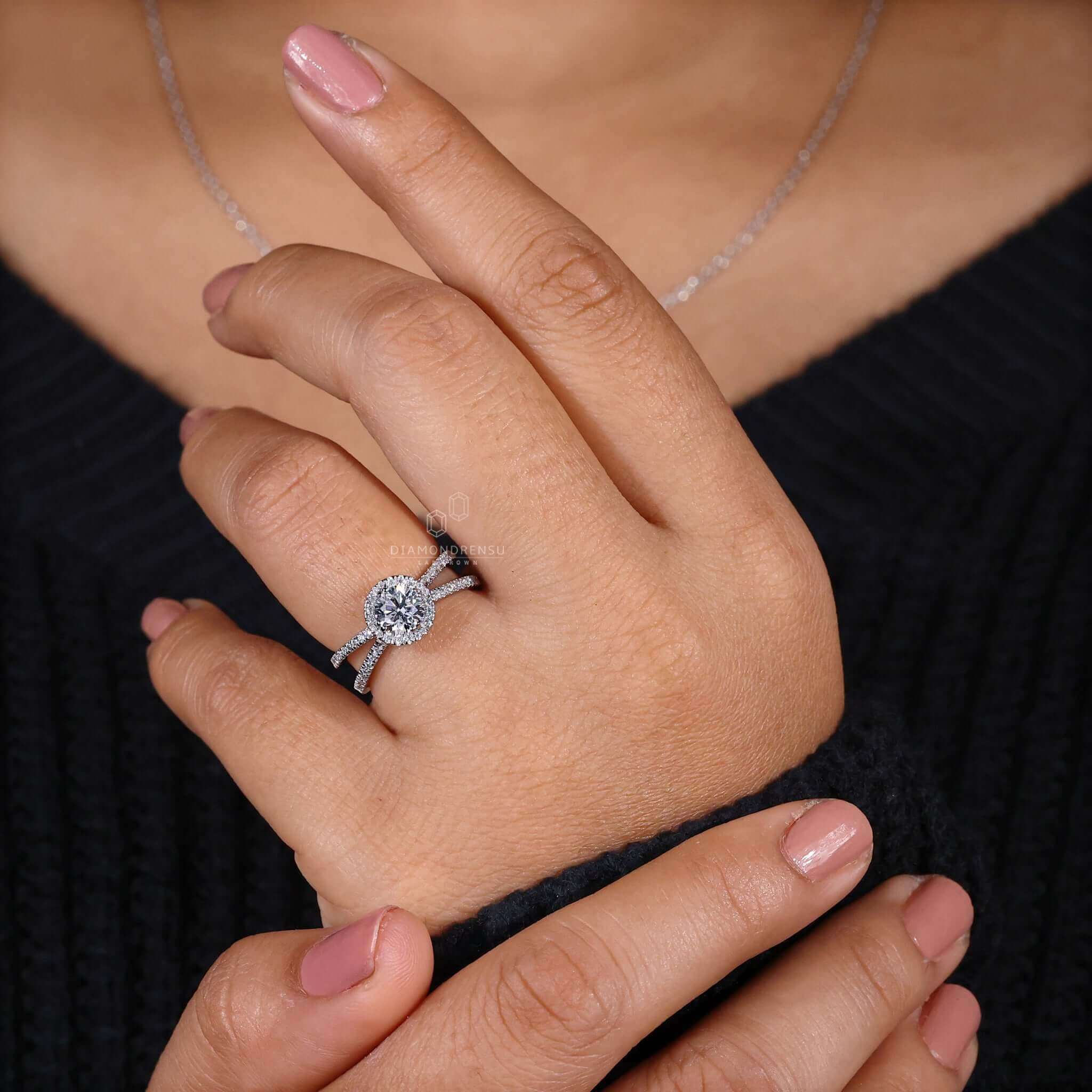 Handmade x shaped ring with a lab grown diamond centre.