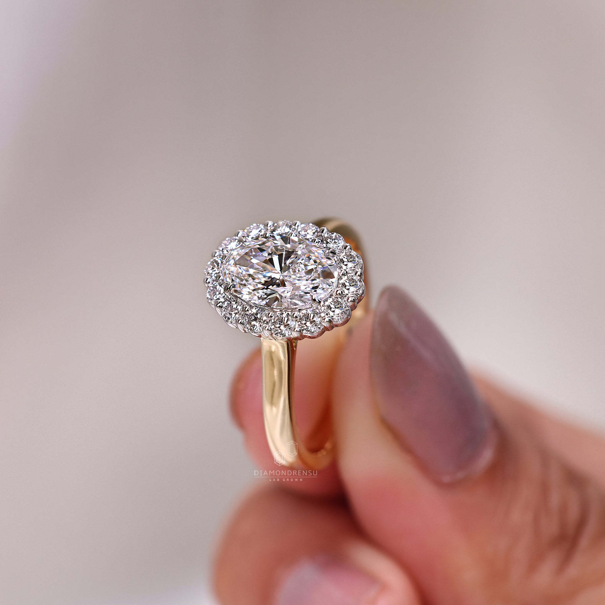 Halo diamond ring with lab grown center stone.
