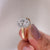 Halo diamond ring with lab grown center stone.
