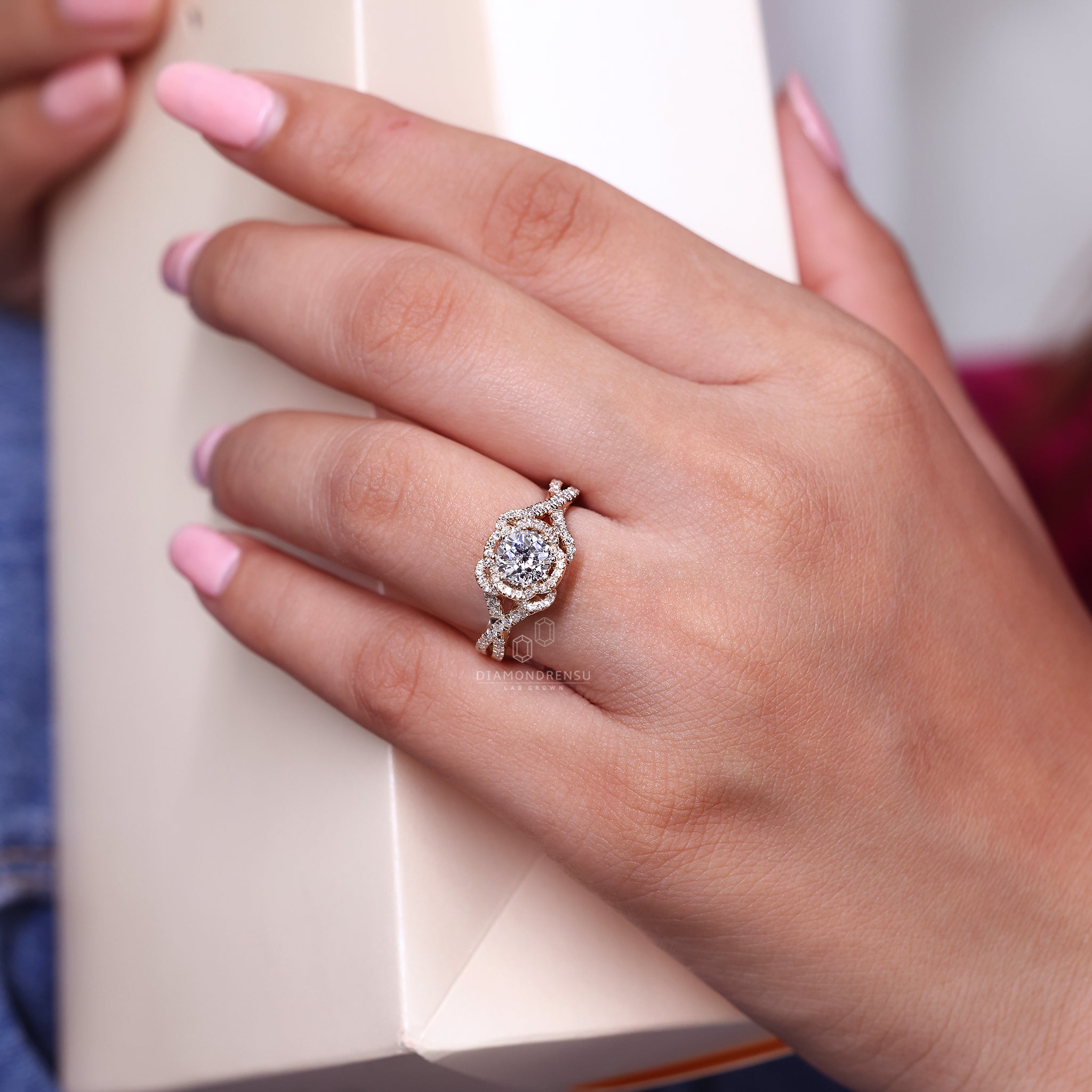White gold ring featuring a Jubilee cut center.
