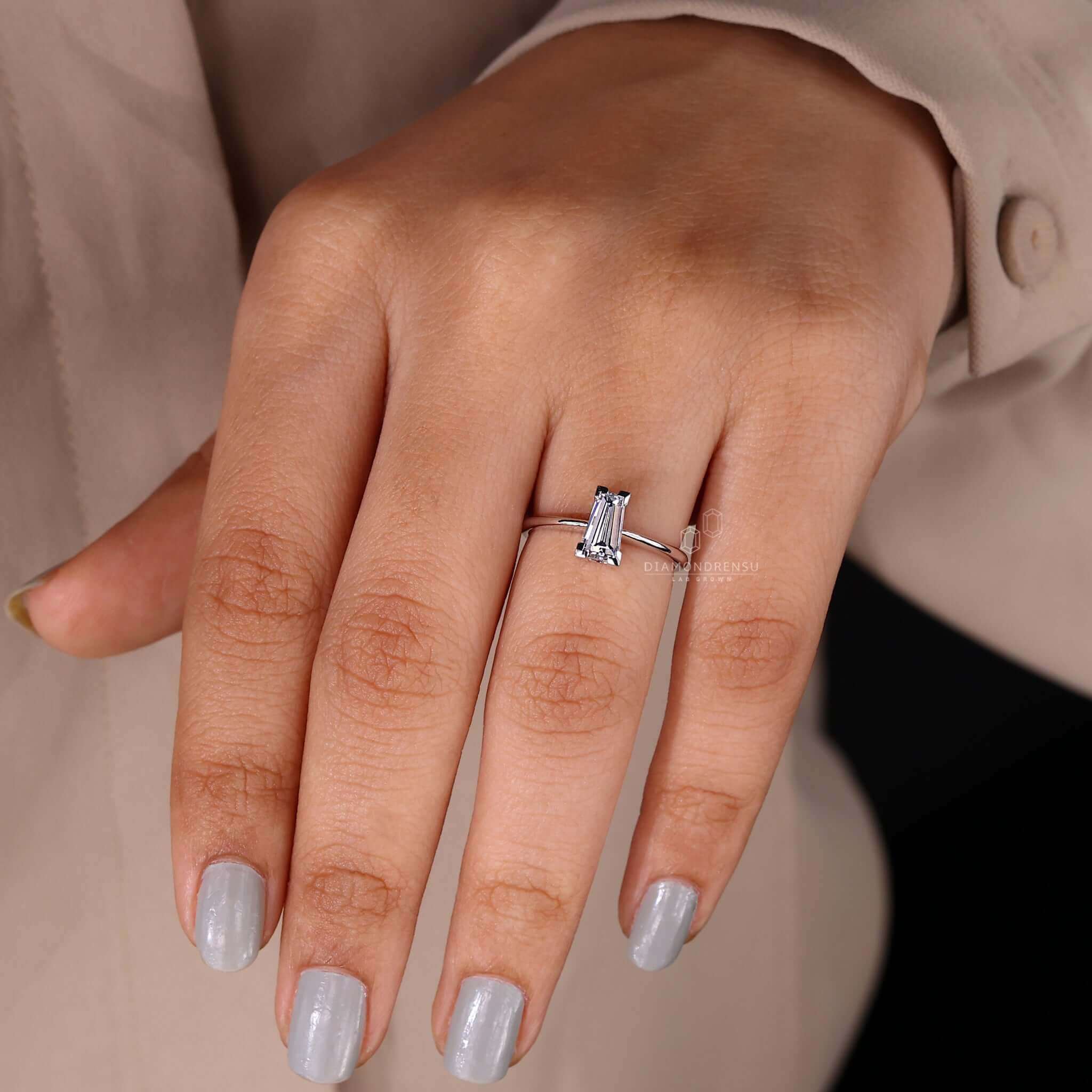 Detailed view of a tapered baguette engagement ring in a basket setting