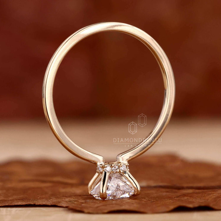 Heart shaped diamond engagement ring featuring a 1 carat solitaire diamond ring set in yellow gold.