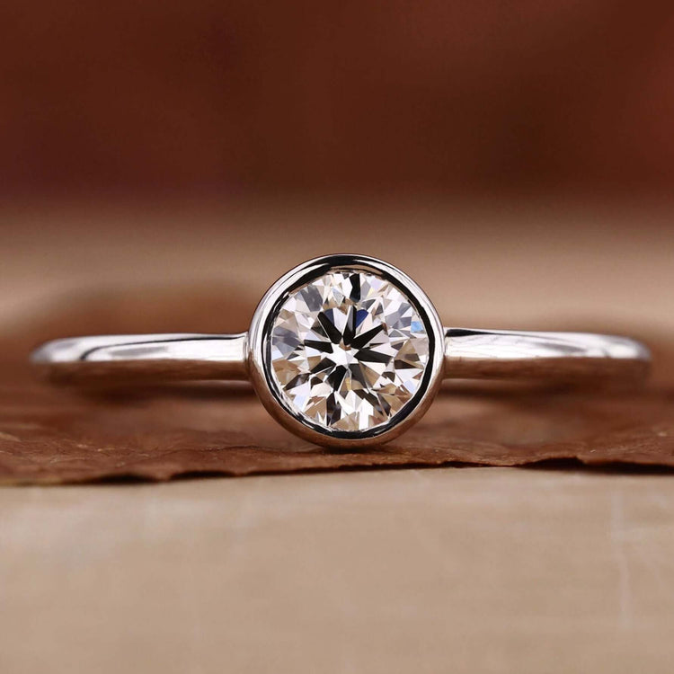 Elegant bezel round diamond ring crafted with precision.