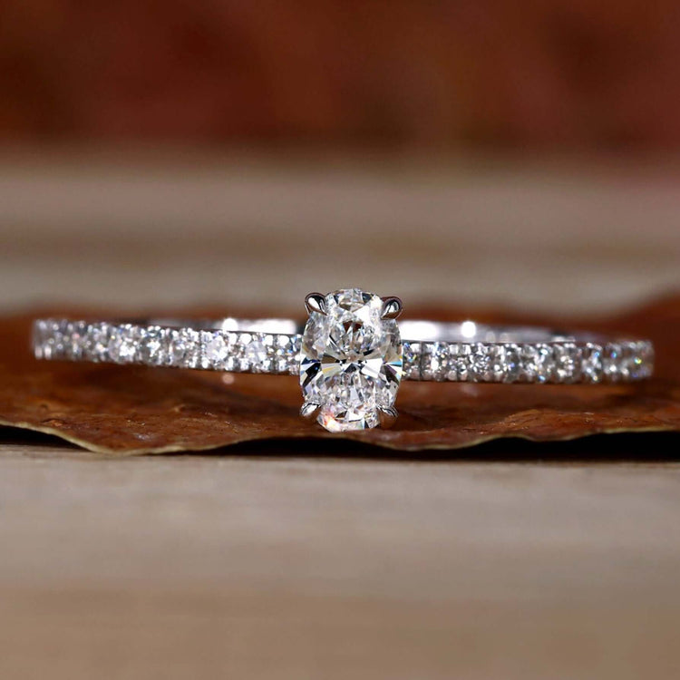 Hidden Halo Engagement Ring with a stunning pave setting and oval diamond, perfect for a timeless engagement.
