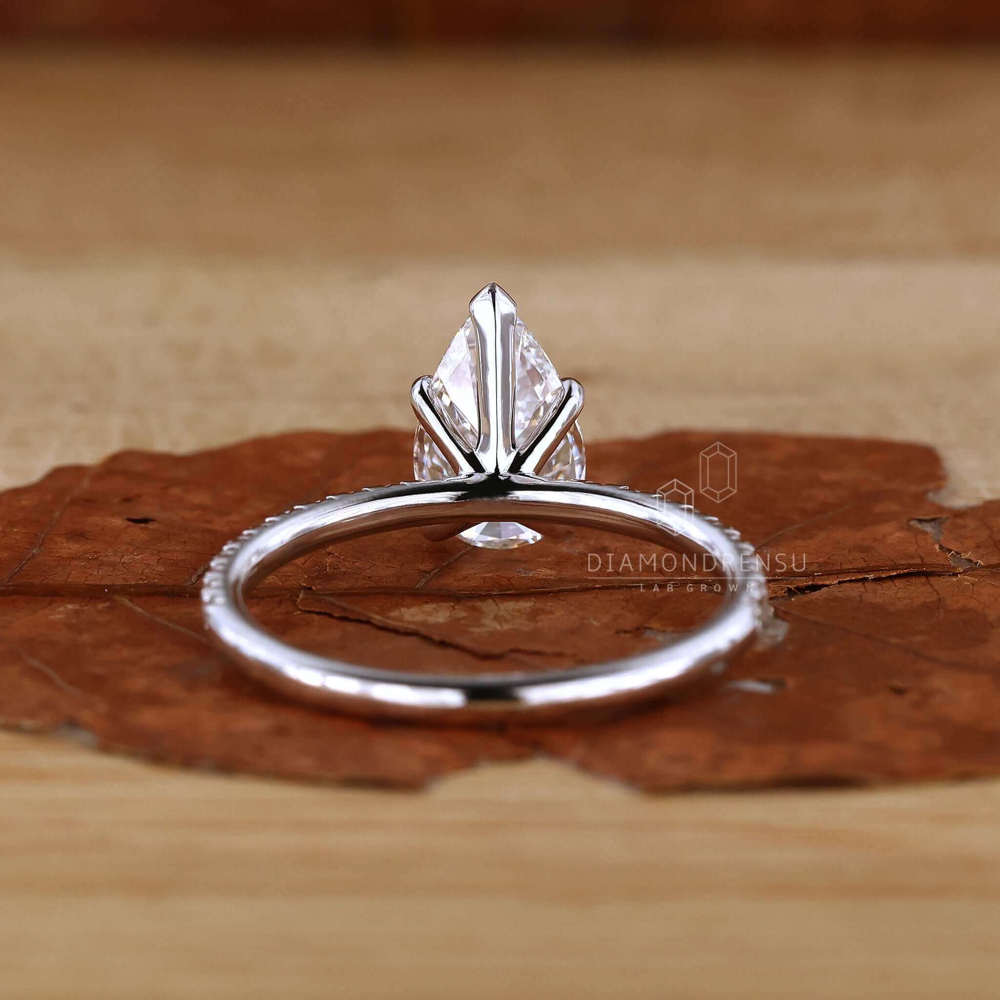 Unique pear pave engagement ring, a true symbol of love and elegance.