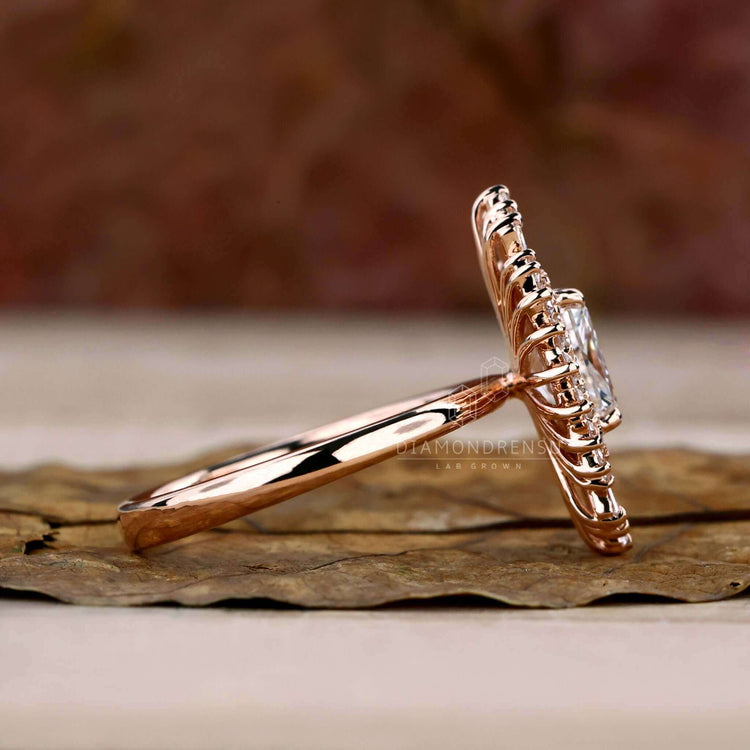 Diamond ring with tapered baguettes and a halo design for extra sparkle