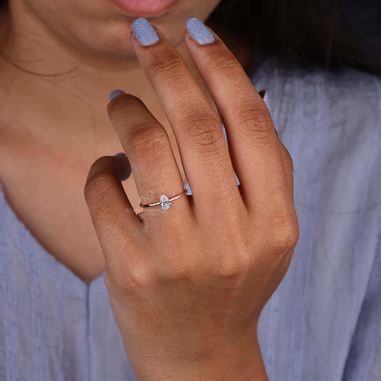 Solitaire diamond ring with a pear shape for a classic touch.