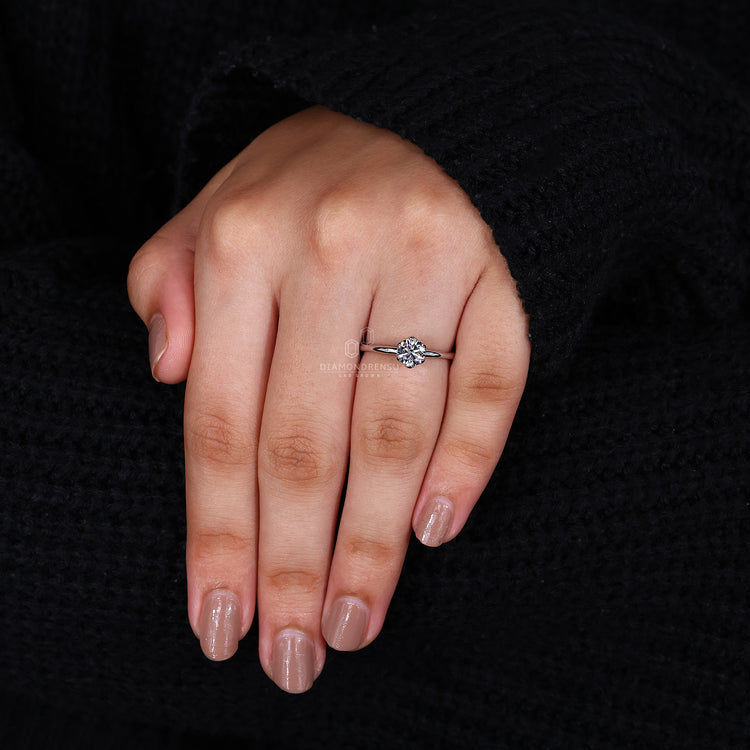 Round solitaire ring crafted as round diamond engagement ring.
