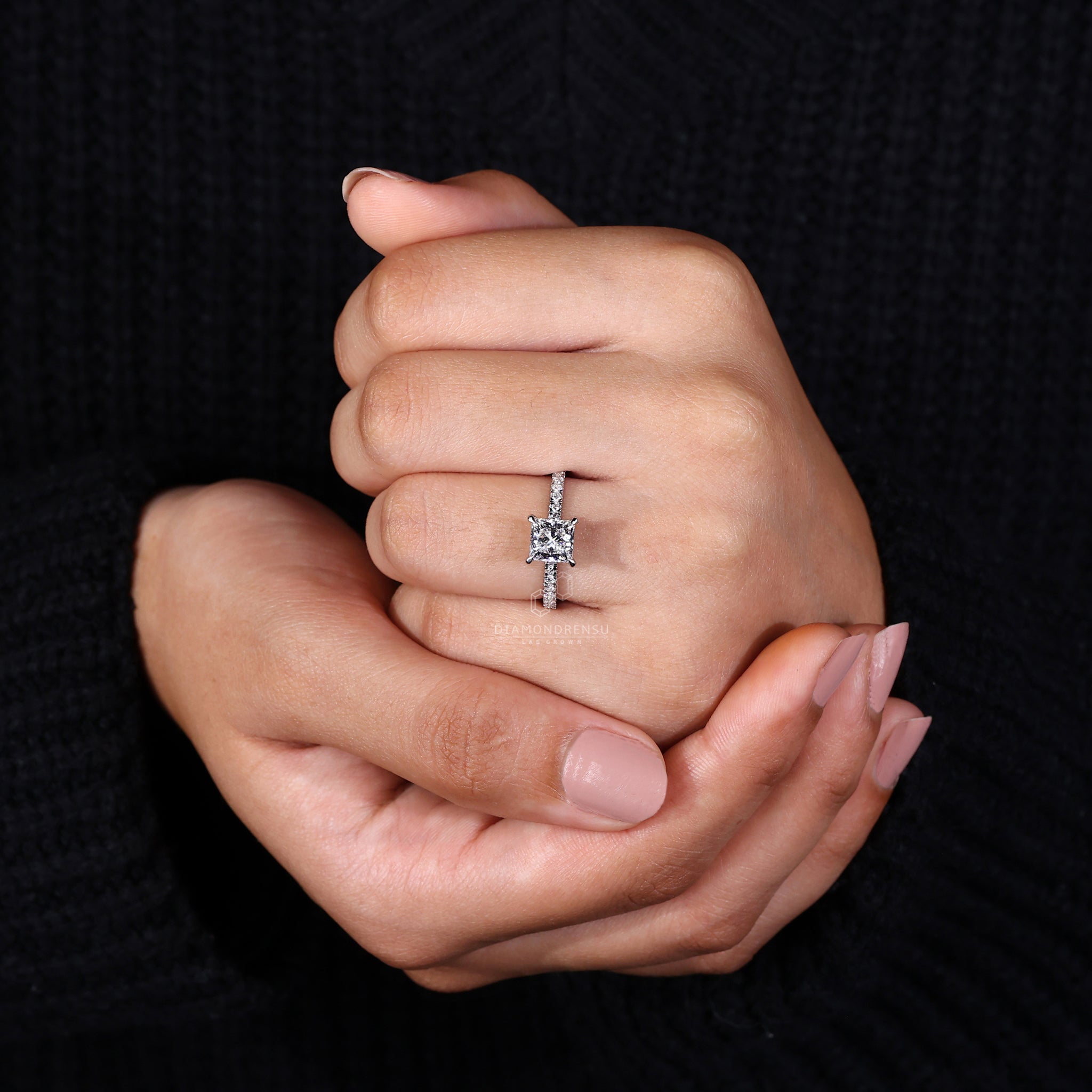 Round cut pave band ring in white gold.
