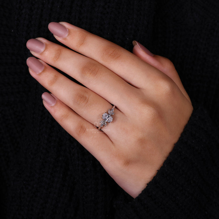 Engagement ring for women with a marquise cut diamond, perfect for a unique engagement ring with side stones.
