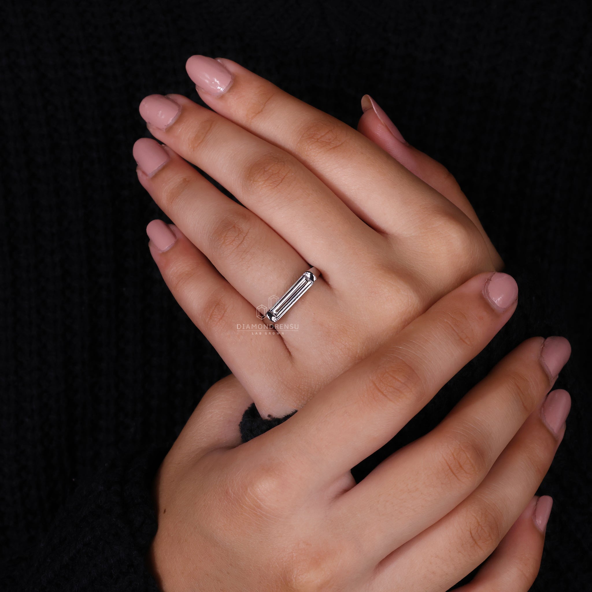 White gold ring with a unique baguette diamond setting.