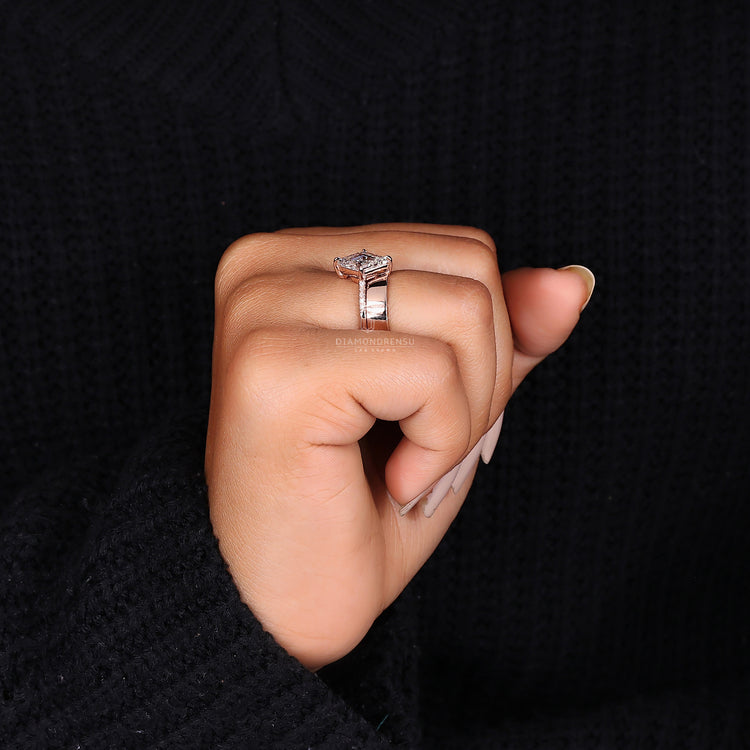 Custom pave setting ring with lozenge cut diamond and plain matching band.
