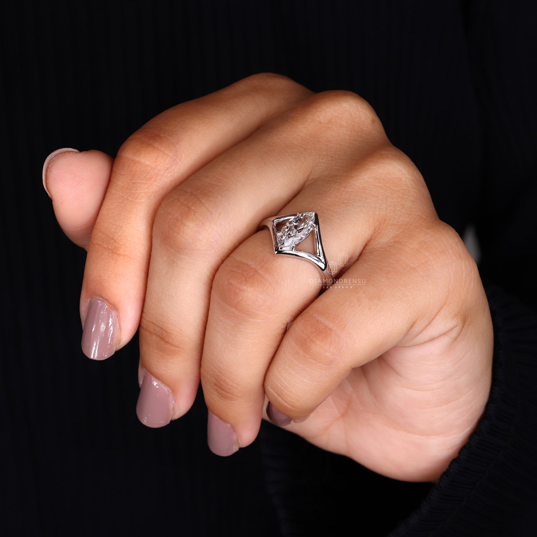 Unique engagement ring designed with marquise engagement ring.

