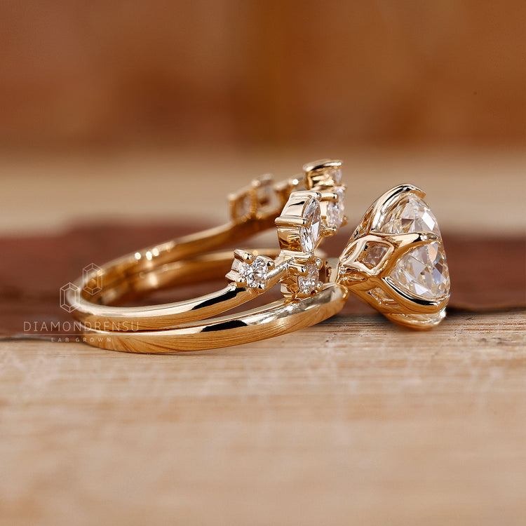 Handmade jewellery set with solitaire engagement ring and curved diamond band.
