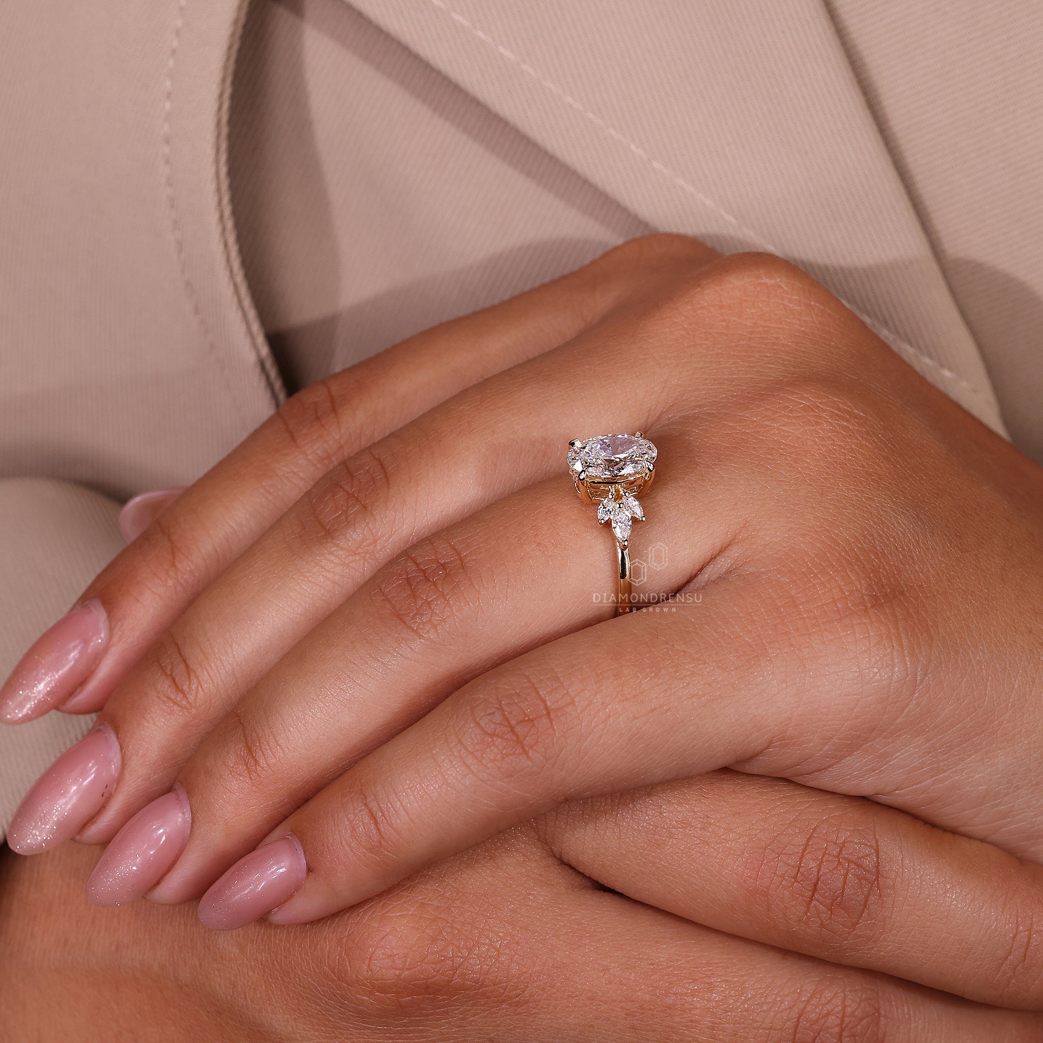 Yellow gold ring with lab grown oval diamond centre.
