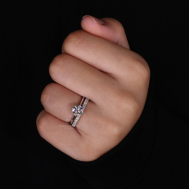 Elegant round cut ring paired with a matching wedding band.
