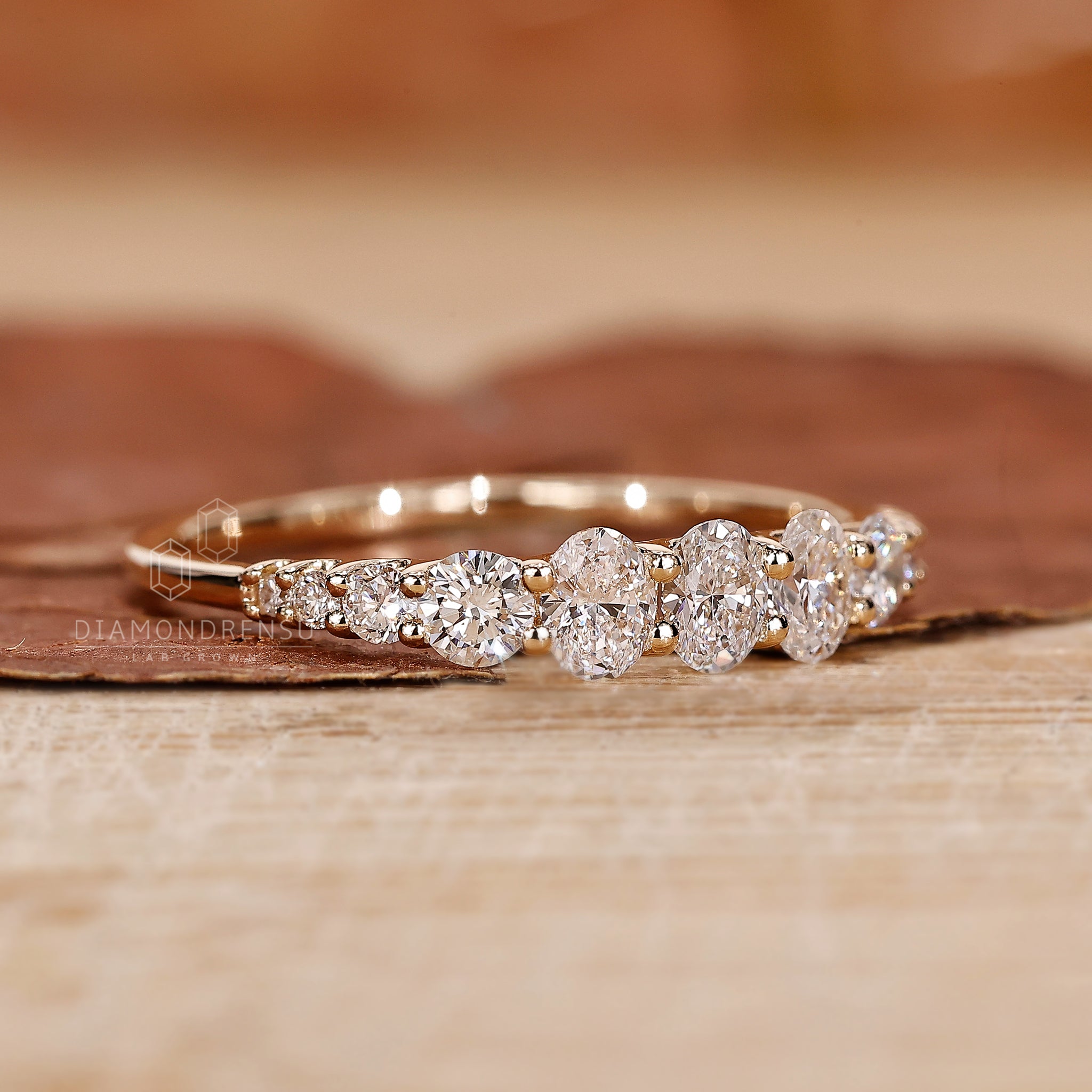 Half eternity diamond band with prong setting.
