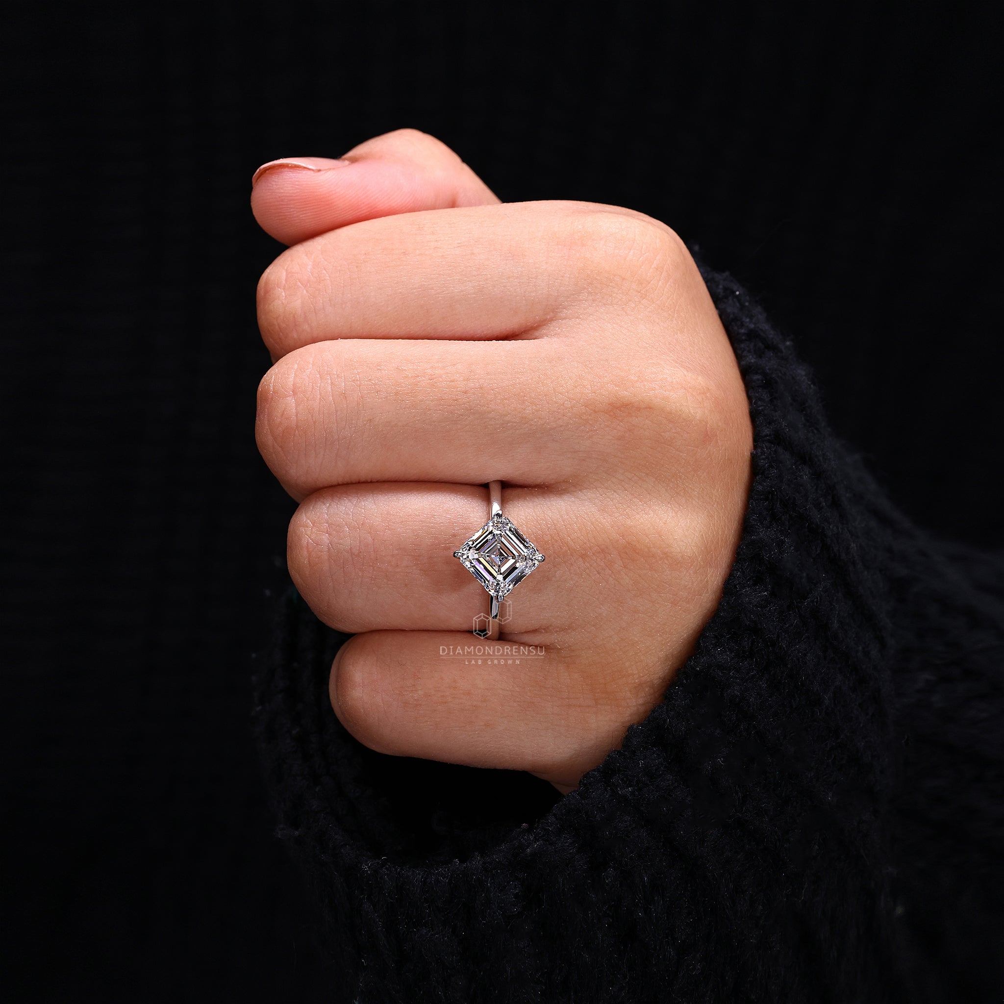Diamond ring UK includes solitaire design with asscher cut and secure prongs.
