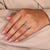 Pear cut side stone engagement ring with hammer finish shank ring.
