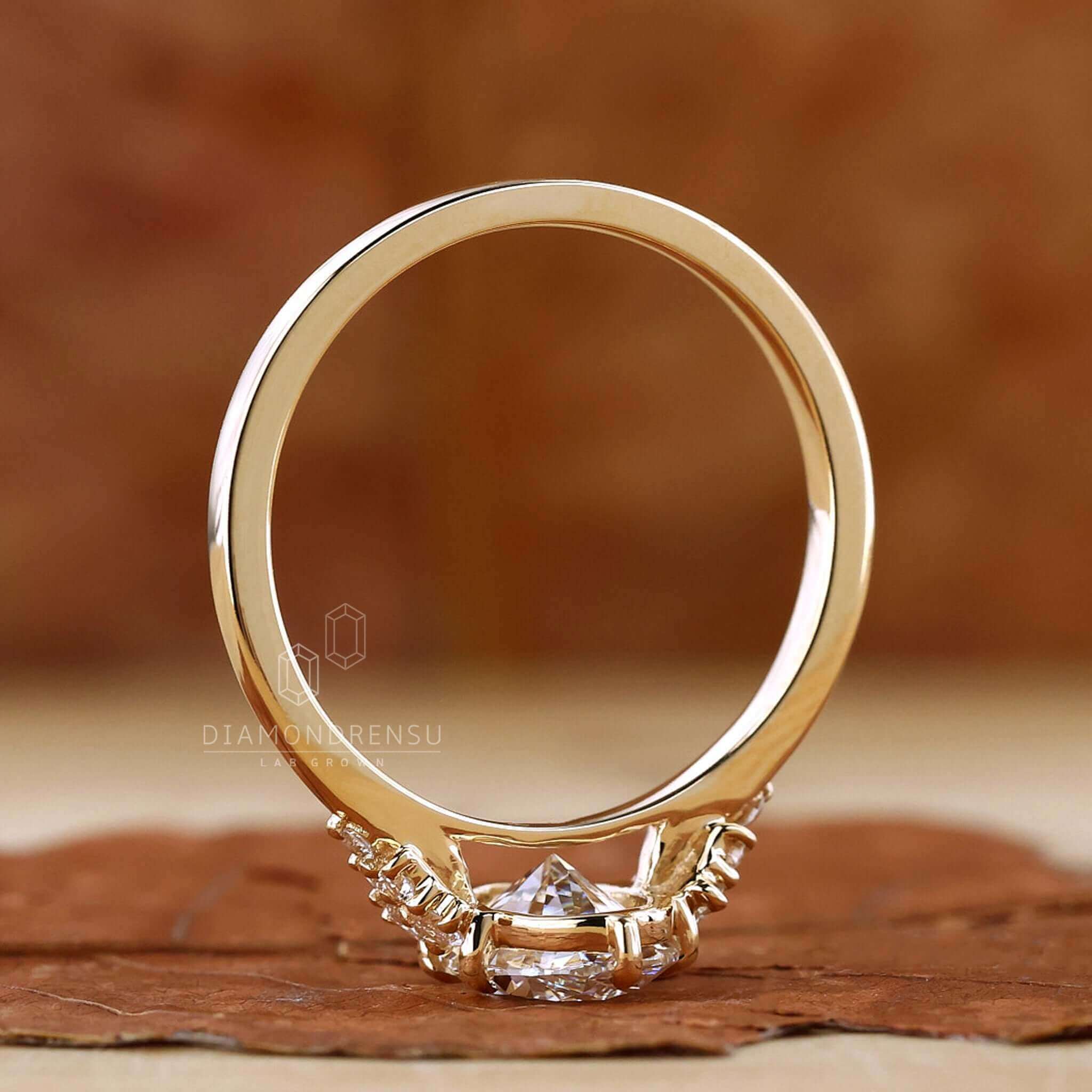 Oval diamond engagement ring with a yellow gold band