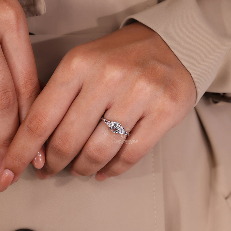 White gold ring featuring a lab grown Portuguese cut diamond.

