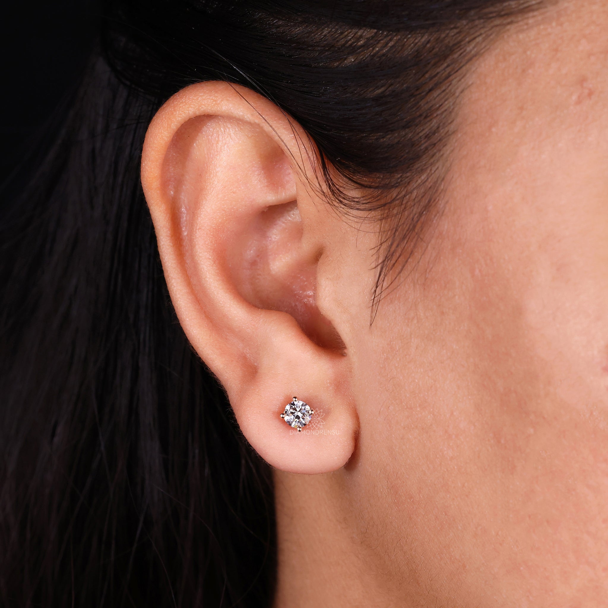 Handmade rose gold earrings with lab grown round diamond studs.