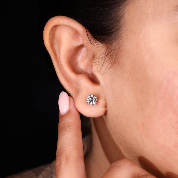 Round diamond earrings with push back.