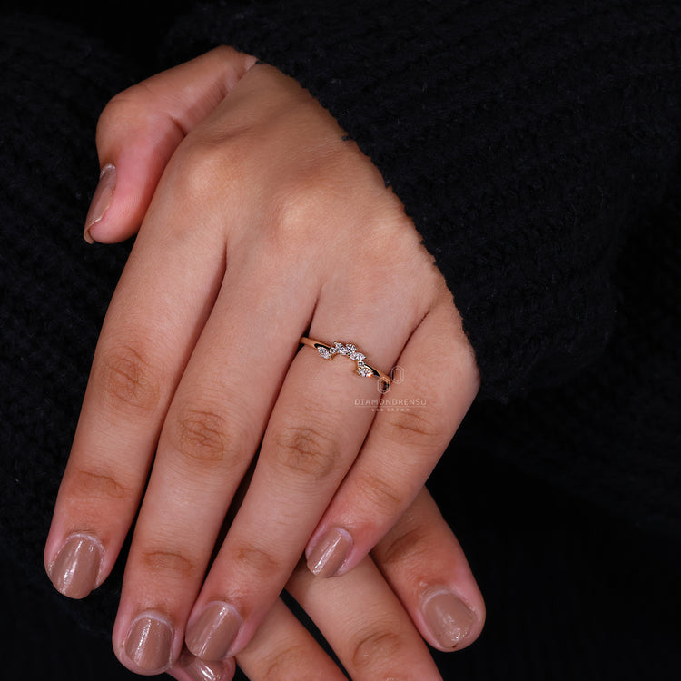 Tiara wedding band with marquise and round diamonds.
