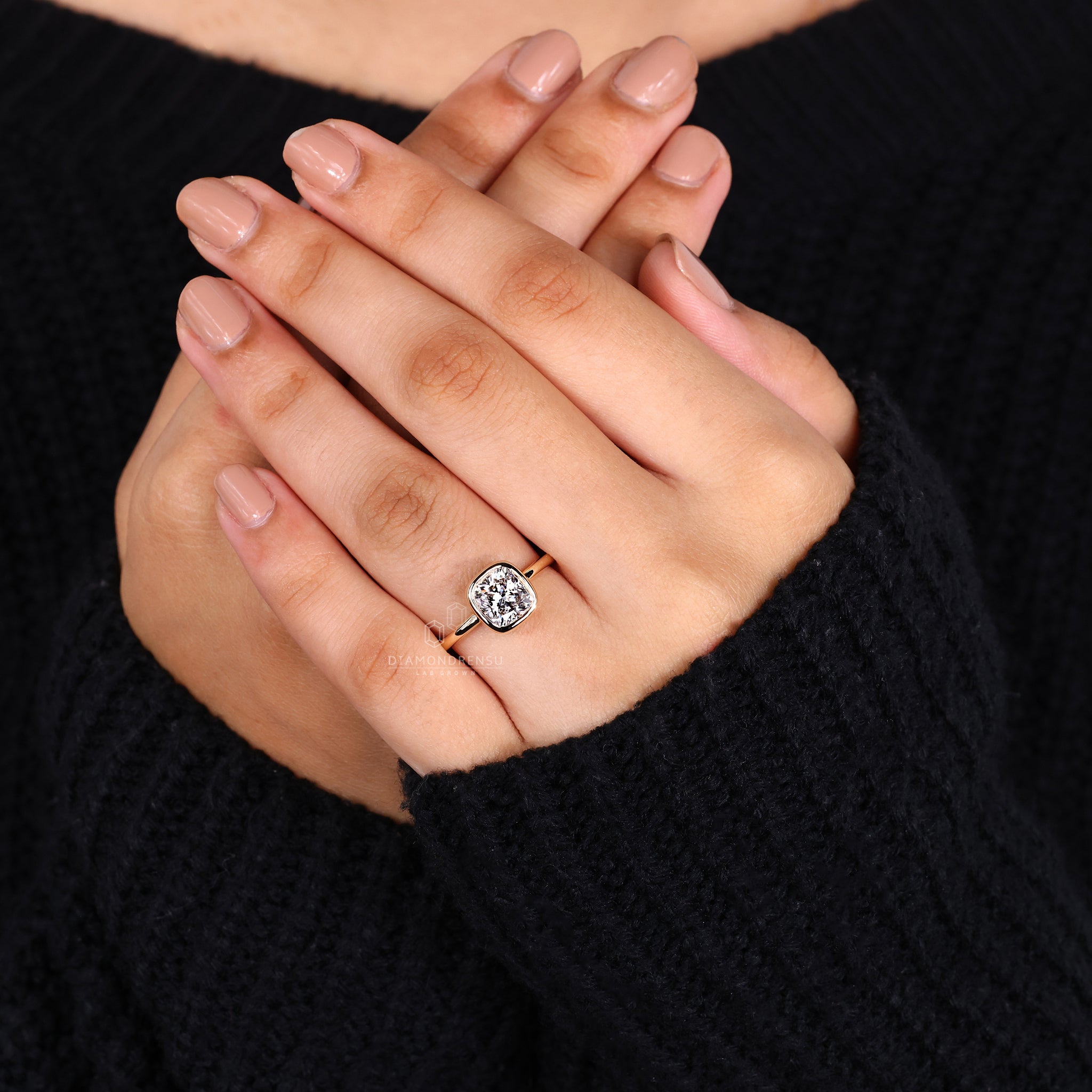 Cushion cut diamond ring is set in a solitaire design for a simple look.
