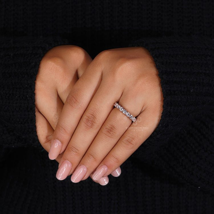 Rose gold wedding band with prong setting
