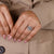 Custom engagement ring with pave set band and hidden diamond accent.

