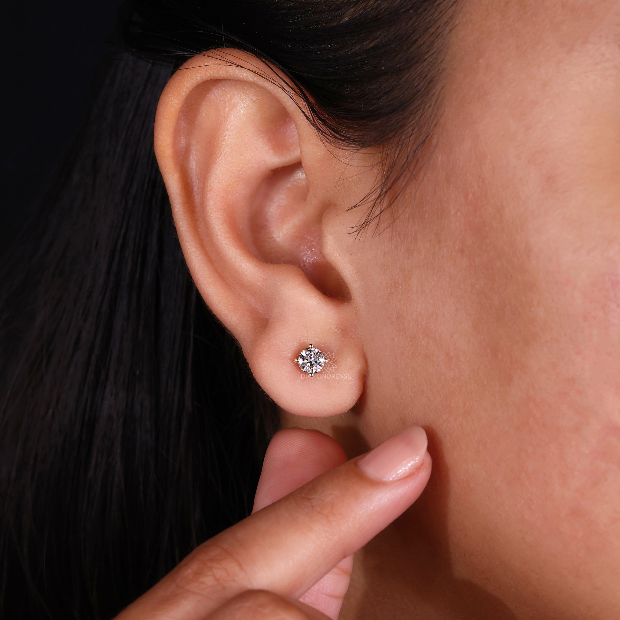 Prong setting earrings designed as classic round diamond studs
