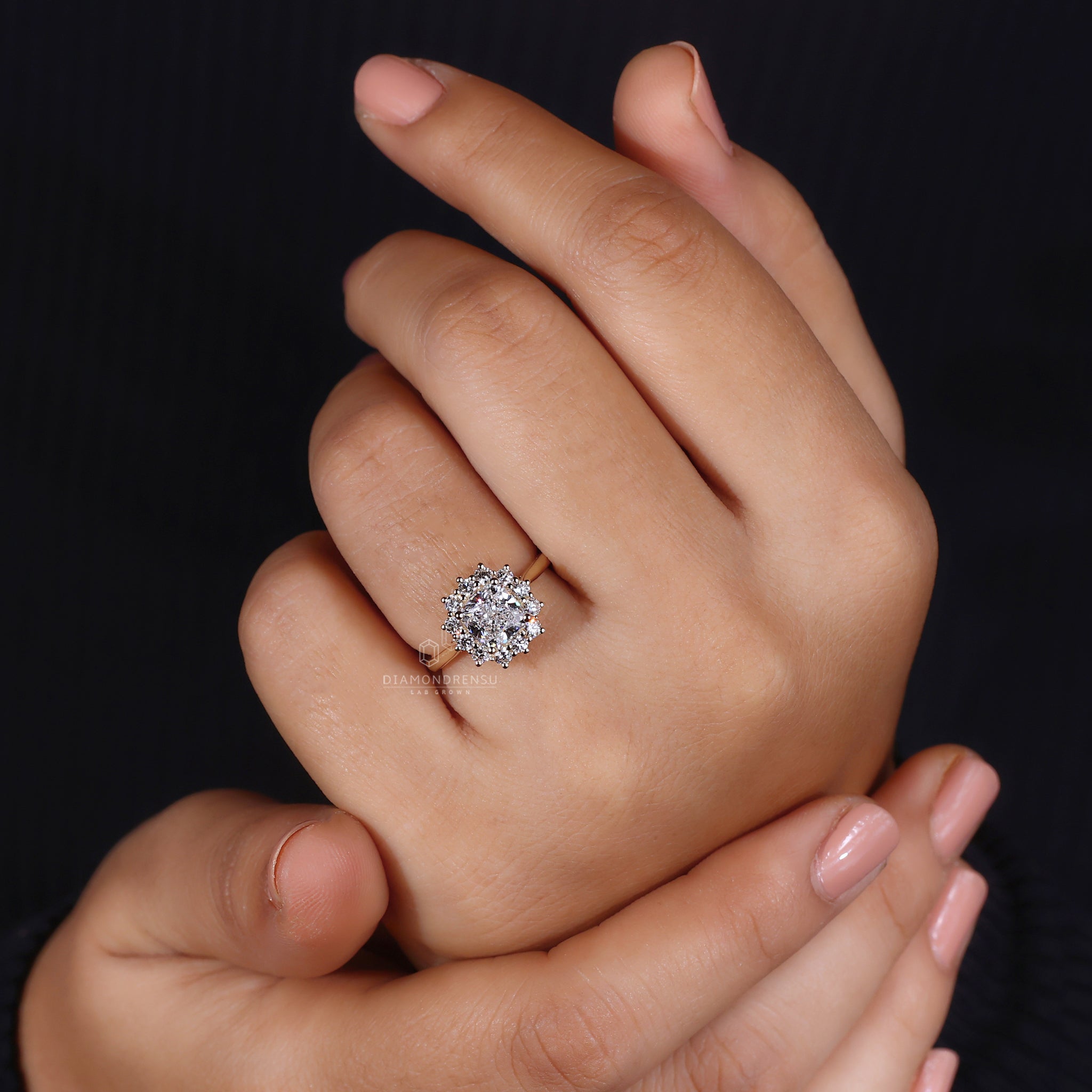 Round cut halo setting with cushion center.

