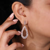 Dangle drop earrings with teardrop shape design.
