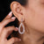 Dangle drop earrings with teardrop shape design.
