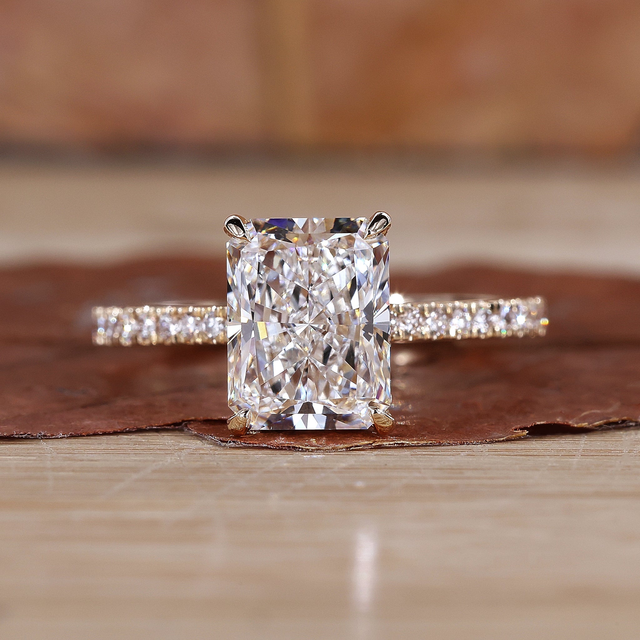 Radiant cut engagement ring with a stunning yellow gold finish.