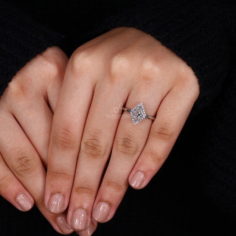 Custom engagement ring featuring lozenge cut diamond and halo setting.
