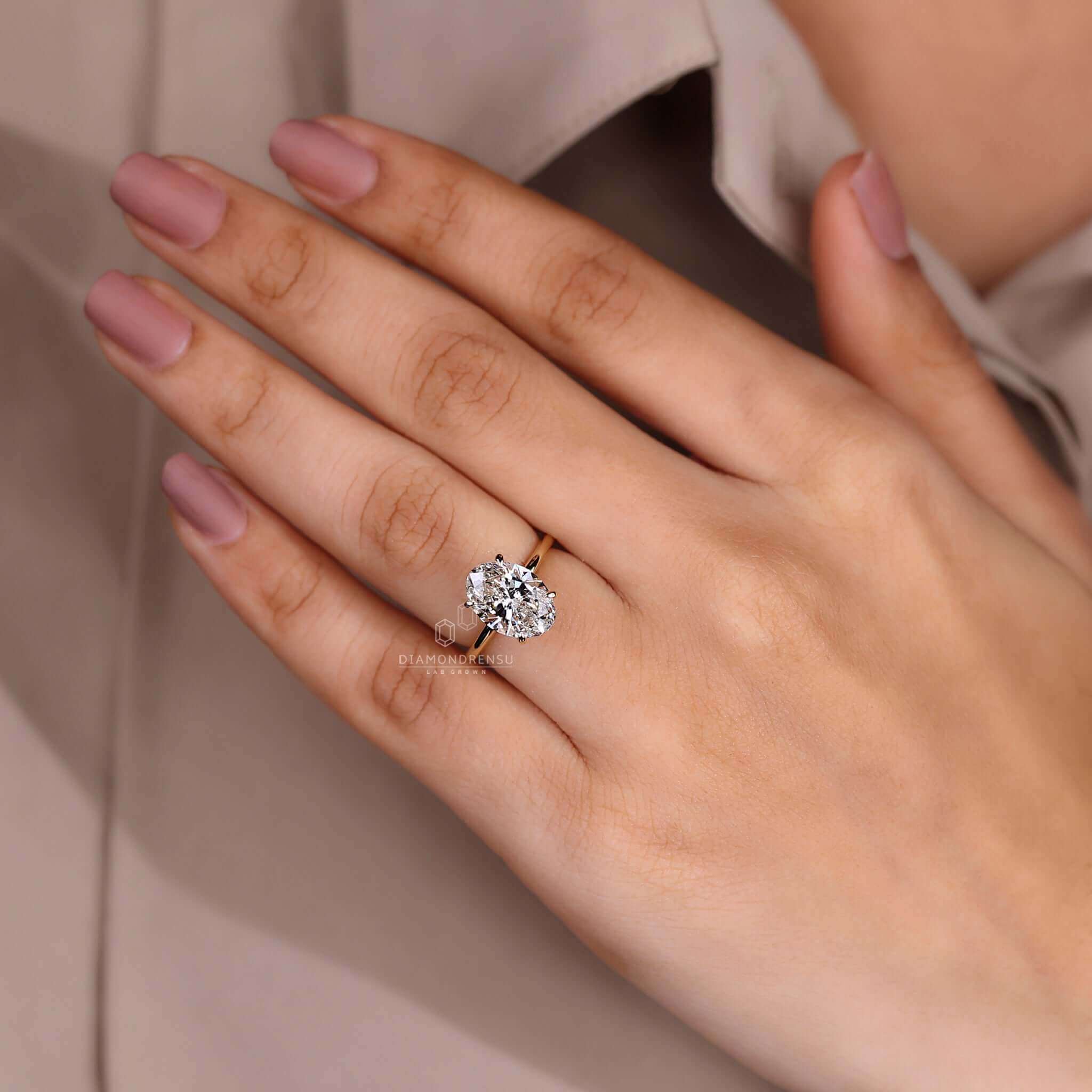 Oval diamond ring in a polished setting, ideal for a sophisticated proposal.