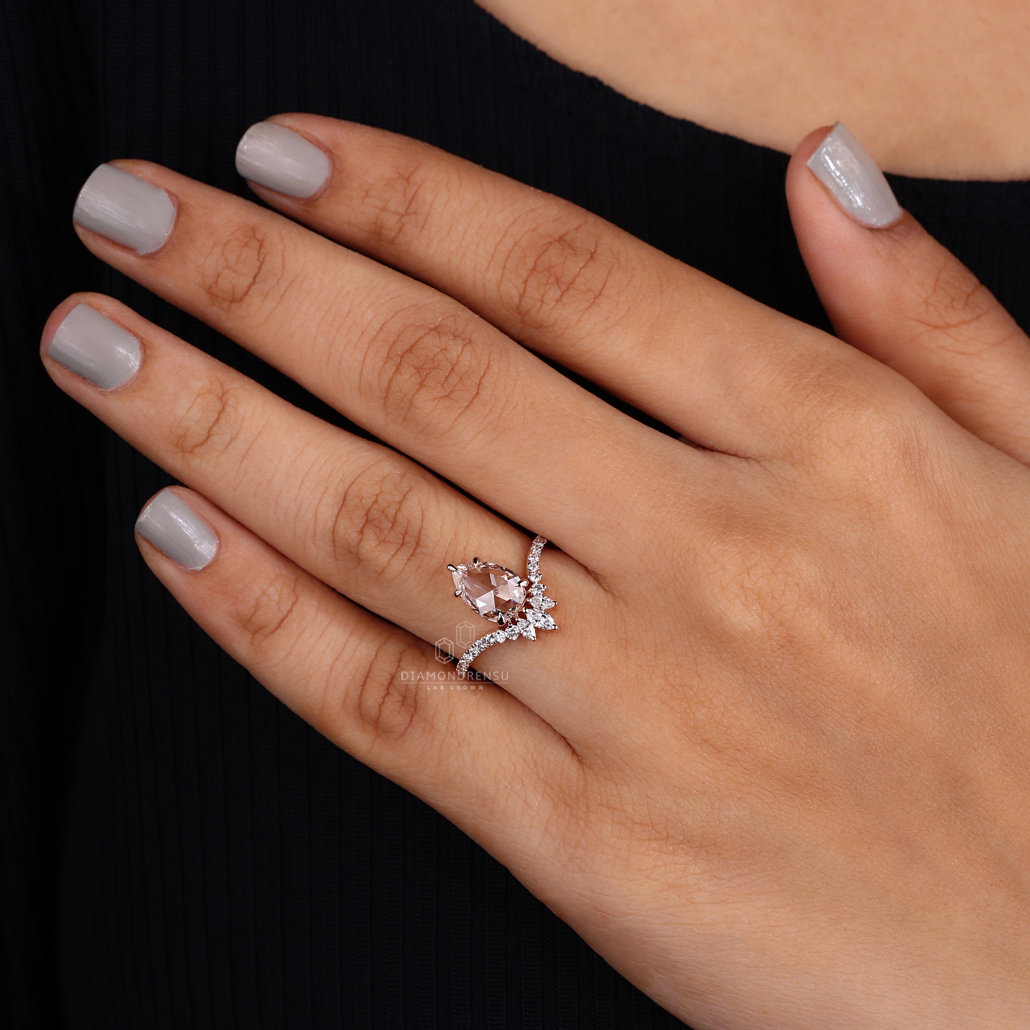 Pear Shaped Diamond Ring with Pave Band on Model's Hand