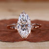 Marquise diamond engagement ring set in a sleek design.
