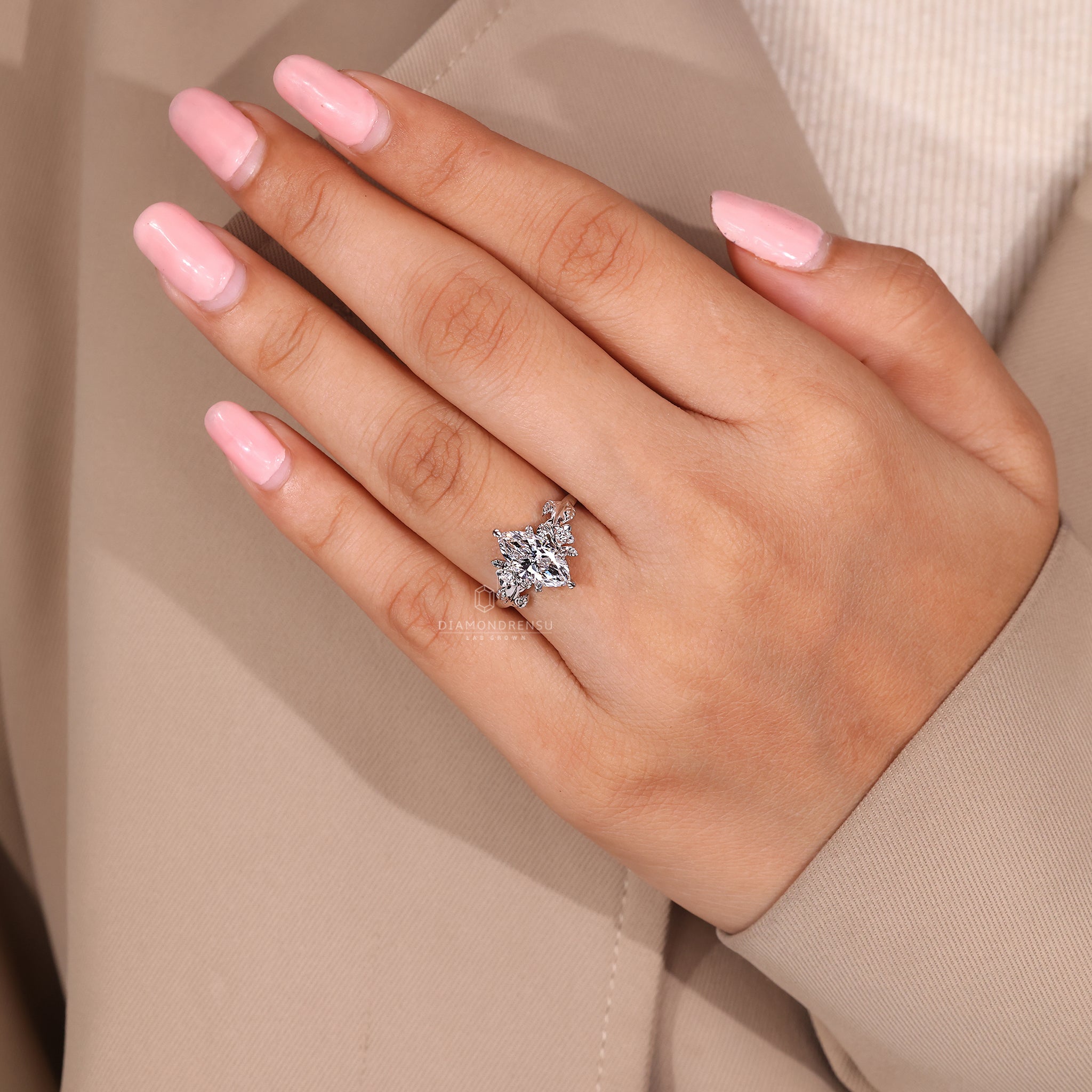 Six leaf style prong ring with marquise diamond.
