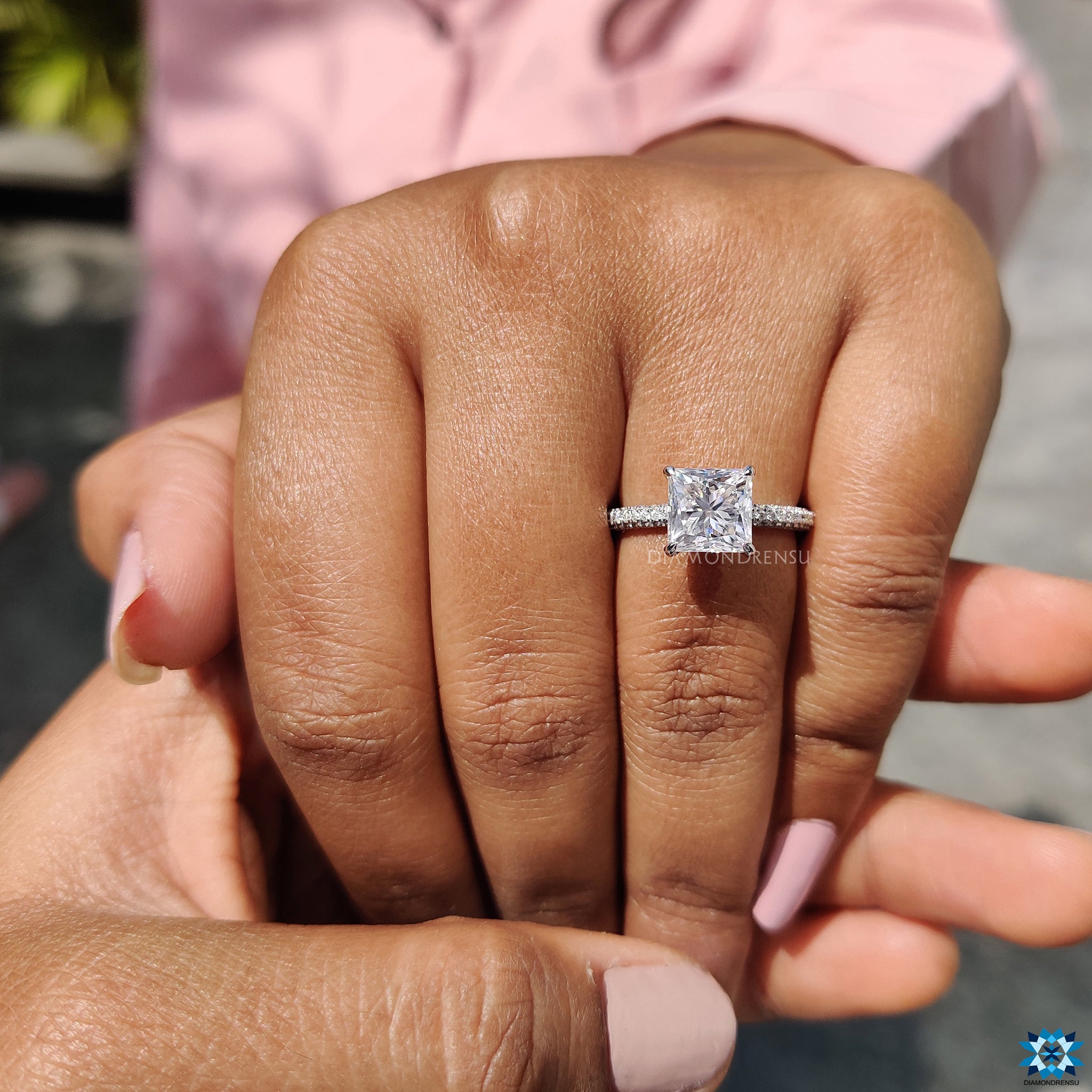 4 prong claw setting ring with princess moissanite and pave details.
