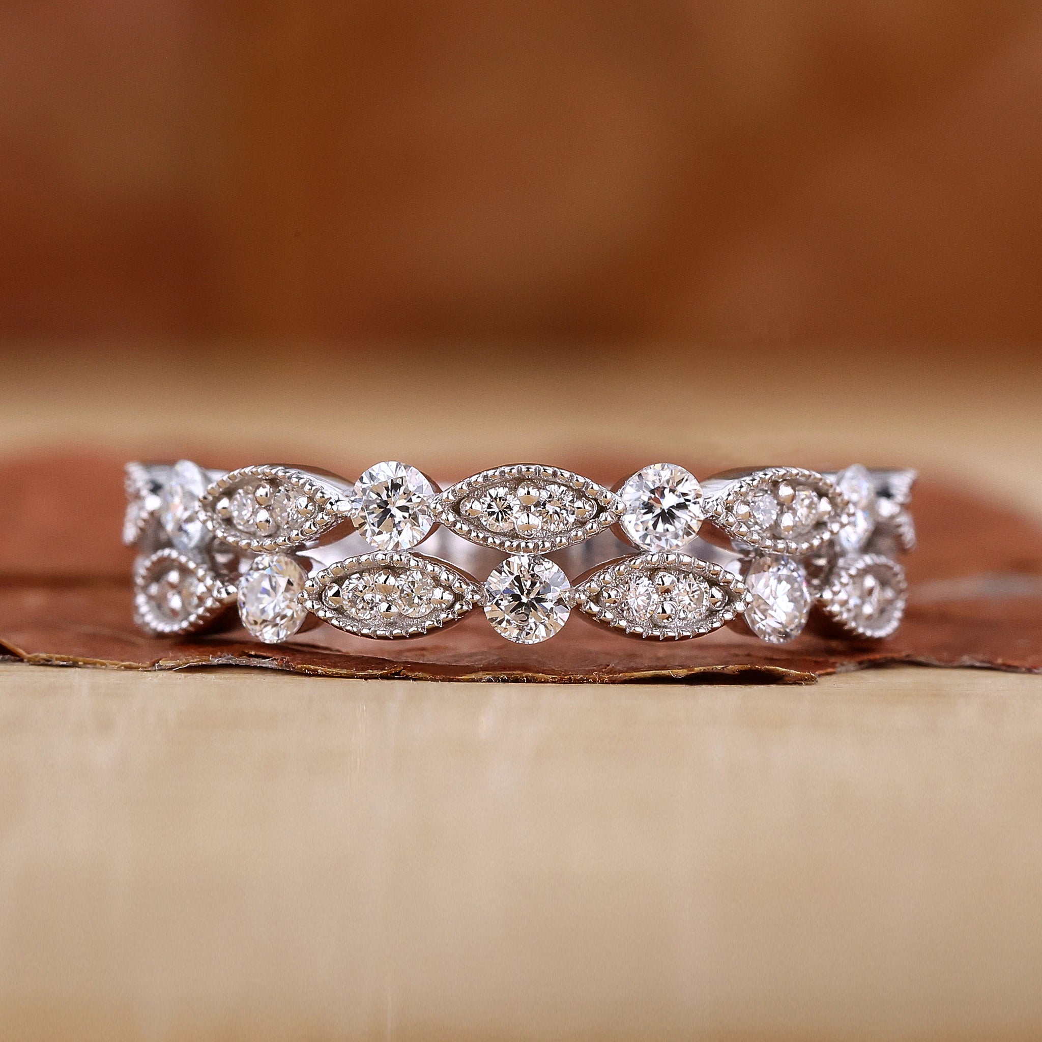Milgrain wedding band with round diamond eternity design
