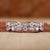 Milgrain wedding band with round diamond eternity design
