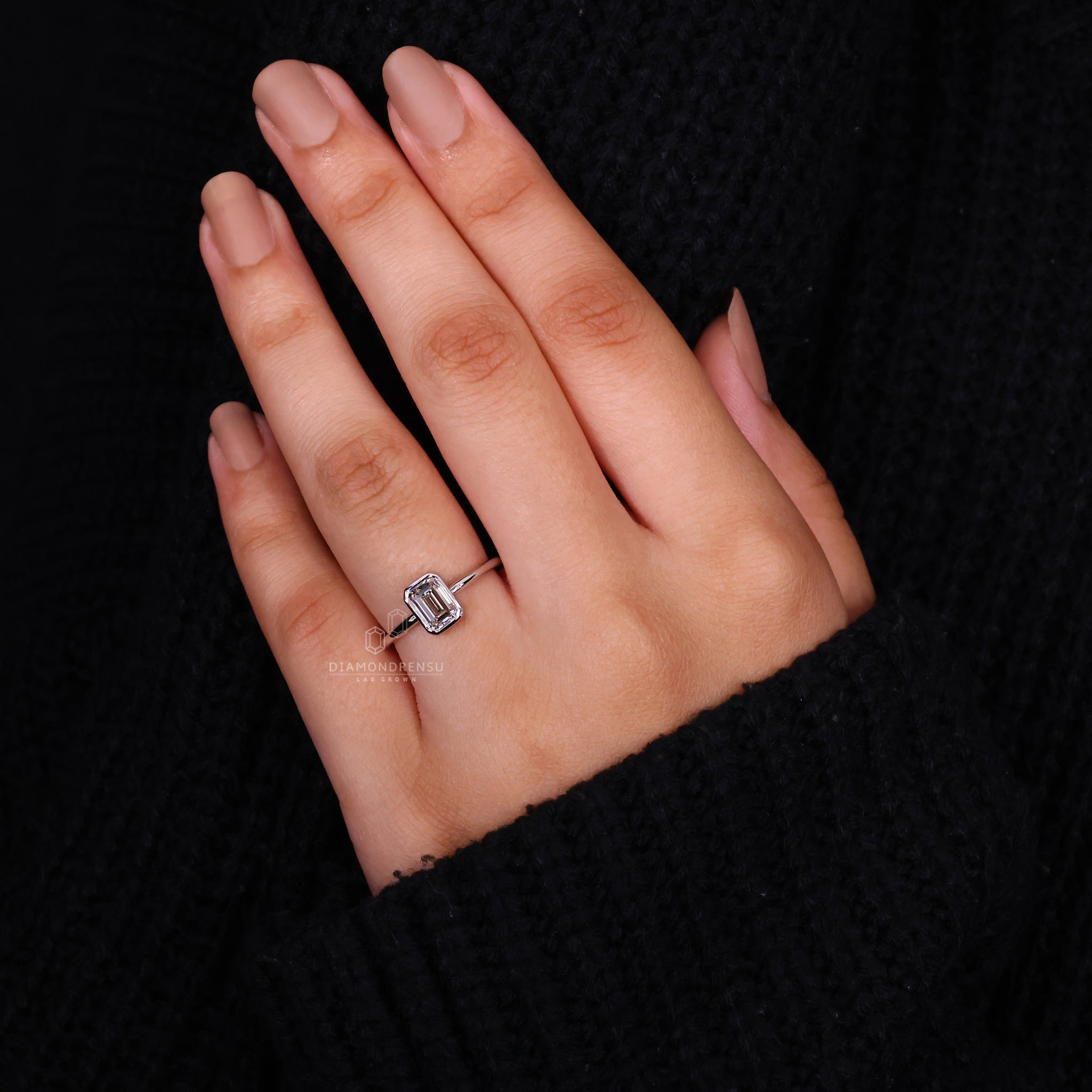 Bezel setting ring crafted in elegant white gold.
