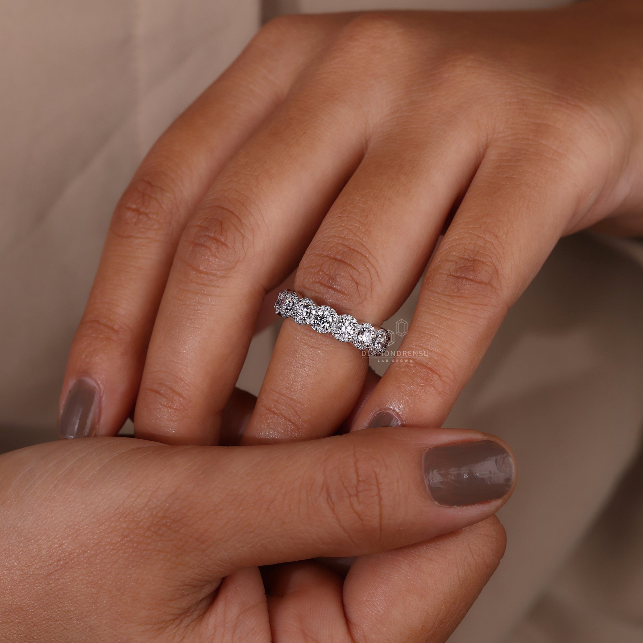 UK wedding band with lab grown round diamonds in halo setting
