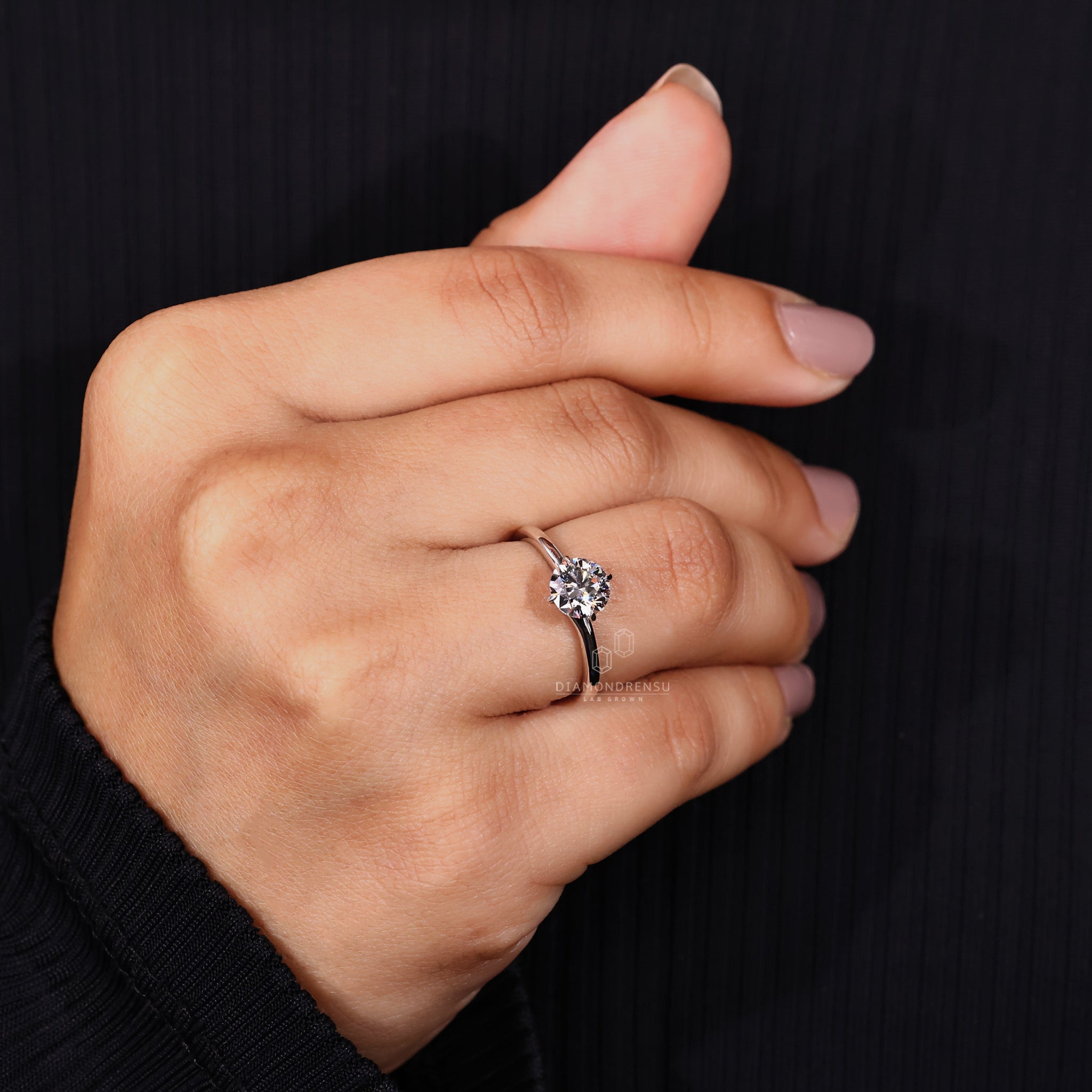 Custom engagement ring designed with round cut solitaire ring.
