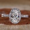 Oval Halo Engagement Ring with sparkling brilliance, perfect for a timeless proposal.