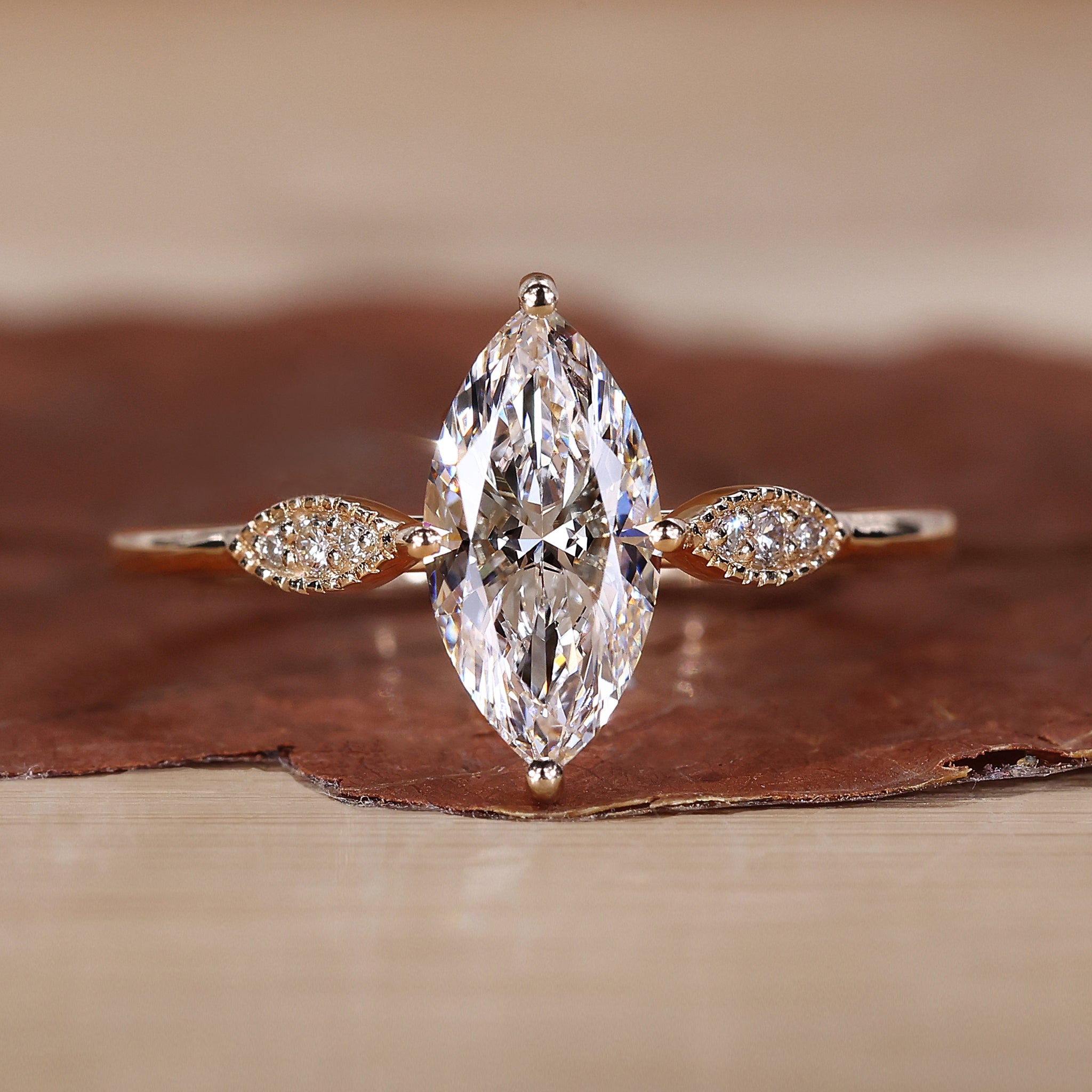 Marquise diamond engagement ring in yellow gold.

